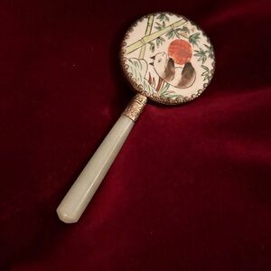 A Vintage or antique Chinese hand mirror